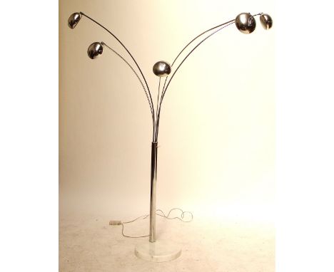 An early to mid 20th century chromed metal floor lamp with five circular lamps on curved stems raised on a circular marbled p