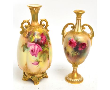 A Royal Worcester hand painted twin handled vase decorated with roses, with pierced rim, pierced handles, and unusual scrolli