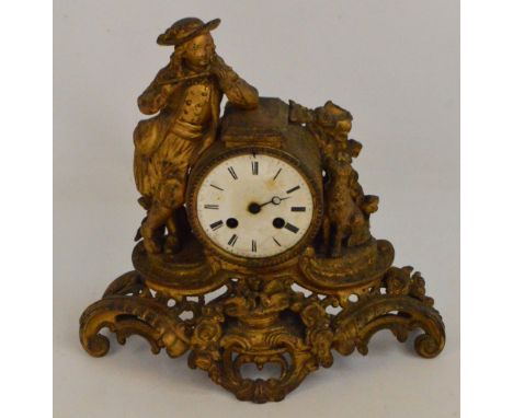 A 19th century French gilt metal eight day mantel clock, the circular enamel dial set with Roman numerals flanked by figure o