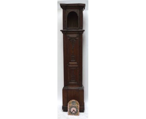 An 18th century French oak longcase clock, the hinged door with carved panels of floral swags and baskets flanked by fluted p