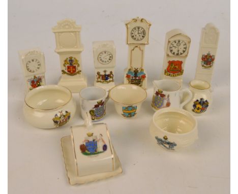 A small collection of crested ware to include longcase clocks related to Chester, Blackpool and Ramsgate, a cheese plate and 