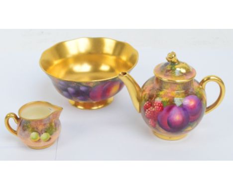 A Royal Worcester miniature teapot, hand painted with fruit by Harry Ayrton, with blue printed marks, length 9.5cm, a fruit d