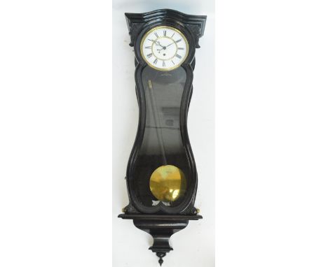 A late 19th century ebonised single weight Vienna style wall clock with shaped case and white enamel dial set with Roman nume