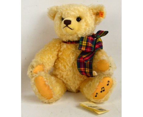 A Steiff Ludwig musical teddy bear, no.661686, retailed by Danbury Mint with yellow and red tag to ear and Steiff swing tag, 