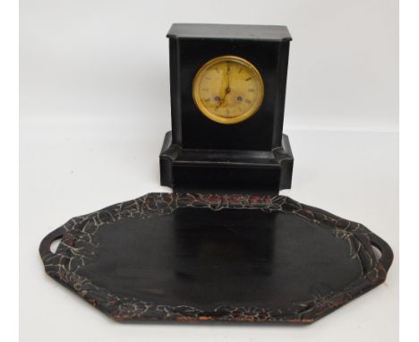 A late 19th century French ebonised eight day mantel clock with circular dial set with Roman numerals, height 32cm and a carv