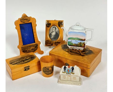 A mauchline ware satinwood rococo style photograph frame with Dunstaffage Castle, Oban, and Oban from the West, complete with