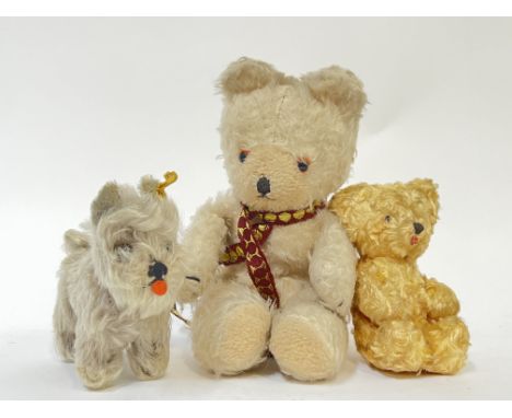 A group of vintage stuffed animals comprising a large white Bear with red/gold scarf (h- 28cm), a smaller golden bear with gl