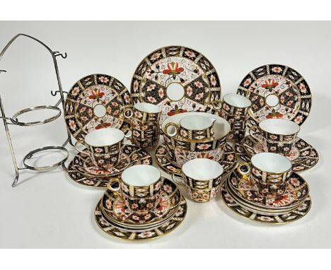 A Royal Crown Derby Imari pattern 2451 teaset comprising a set of six circular loop handled tea cups (6cm), a set of six sauc