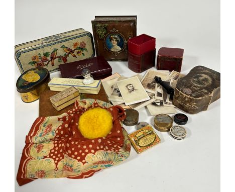 A rectangular treen box with birds on a branch, an egg shaped tin with mixed Dainty Toffees by George W Horner, a ceramic Vic