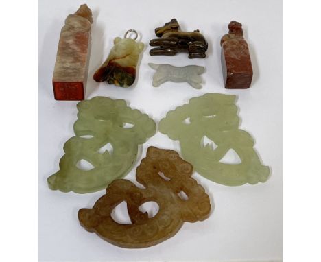 A group of Chinese carved stone items comprising three Jade carvings of mythological creatures (white/green-brown) (w- 7.5cm)