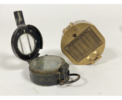 A World War Two military marching compass by T.G.Co, Ltd London, dated 1944 and stamped with British military ordnance arrow,