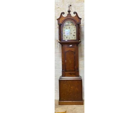 A mid 19th century mahogany and oak longcase clock, the hood with urn final and swan neck pediment over wide case with short 