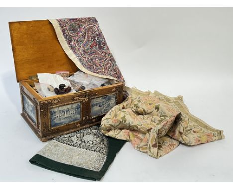 A large wooden sewing box with Delft style blue and white tile decoration to the exterior and removable interior shelf with b