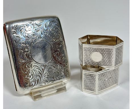 A pair of Birmingham silver octagonal engine turned napkin rings (3cm x 5cm x 3cm) (40.4g) and a Birmingham silver engraved c