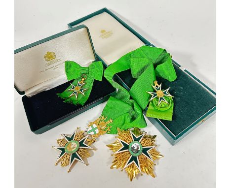 A group of gilt metal and enamelled Maltese Cross regalia on satinised silk style green ribbon, including a ribbon with butto