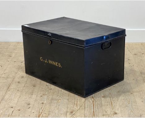 A late 19th century black japanned tin uniform trunk, the hinged lid opening to a plain interior, carry handle to each end, C