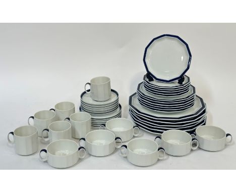 A Rosenthal Studio Line blue rimmed twelve sided dinner service comprising six dinner plates(w-26cm), six teacup saucers, six
