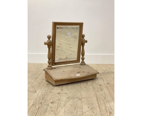 A pine dressing table mirror, the bevelled glass swivelling between turned uprights over a trinket box, H58cm