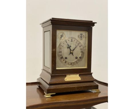 An Edwardian mahogany cased ting tang bracket clock, with bevelled glass to all sides, on brass bracket supports, the silvere
