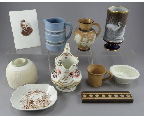 A collection of nineteenth and twentieth century pottery, c.1830-1920. Yo include: a named and dated porcelain floral mug, a 