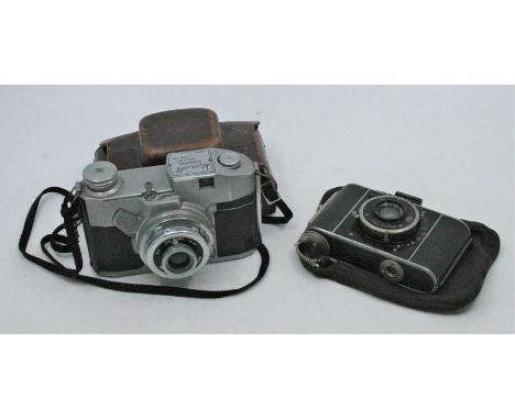 A Koroll film camera in its leather case together with a J. Deckel Compuk camera in a later canvas bag, both cameras appear c