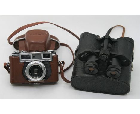 A Yashica Minister camera, with its original case (leather strap AF), no. II 5064108, together with a USSR made pair of Binoc