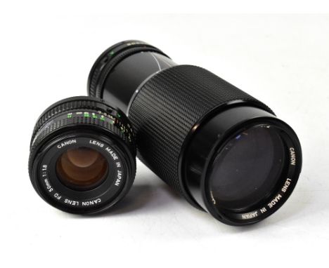 A Canon FD 50mm 1:1.8 camera lens and a Canon FD 70-210mm 1:4 zoom lens (2). CONDITION REPORT: Both lenses are in good cosmet