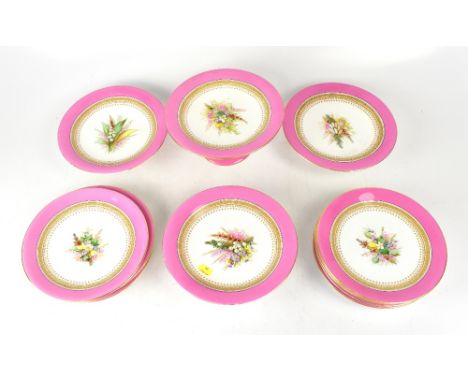 ROYAL WORCESTER; a 19th century dessert and cake stand set, comprising nine plates with central hand painted bouquets of gard