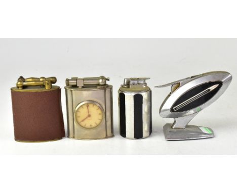 Four vintage table lighters including a T-21 Robin, a table lighter by Maruman, a metal cylindrical lighter with alternate bl