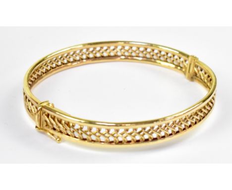 A 9ct gold lattice design bangle, approx 10g. 