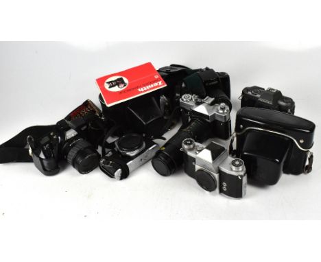 A metal camera case and eight assorted SLR cameras and lenses including Minolta, Dynax 3000i, a Canon E0S100, a Pentax OED, a