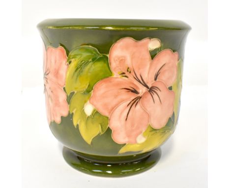 WALTER MOORCROFT; a green ground 'Hibiscus' pattern planter, signed, initialled and factory stamp to the base, 13 x 13.5cm.