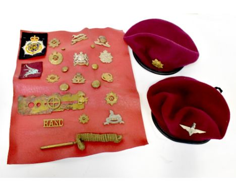A collection of military and other cap badges to include the Lancashire Fusiliers, The Border Regiment, Royal Army Ordnance C