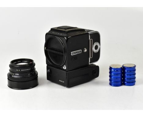 A Hasselblad 500 EL/M medium format film camera with a Carl Zeiss planar 1:2.8 F=18mm lens, contained within a fabric camera 