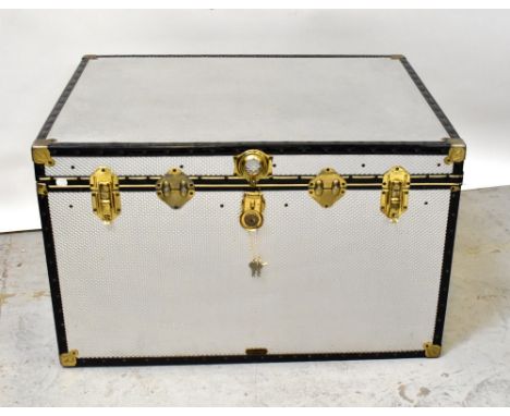 A very large modern alloy metal bound trunk.