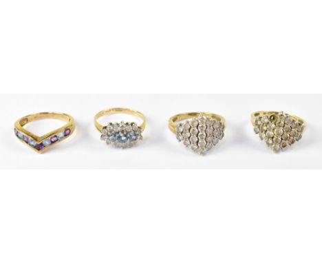 Four 9ct yellow gold dress rings comprising two marquise-shaped examples set with cubic zirconia, both size J, a floral set r