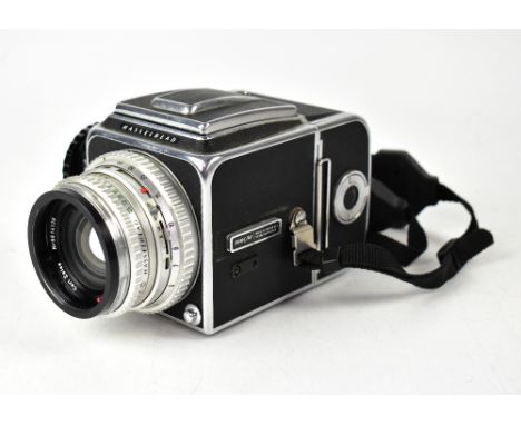 A Hasselblad 500C-M medium format film camera, serial no.UH 133930, fitted with a Carl Zeiss planar 1:2.8 F=mm lens, with acc