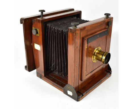 A 19th century Meagher mahogany plate camera with internal barn door shutter. CONDITION REPORT: The camera has scuffs, scrape