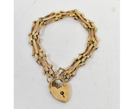 A vintage 9ct gold three bar gate bracelet with 9ct gold heart-shaped padlock clasp, length 15cm, approx 7.4g.