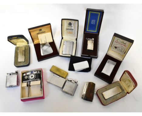 A collection of various vintage lighters, including Marunan, Dunhill, Dupont, Ronson, and an Oriental Photolite novelty light