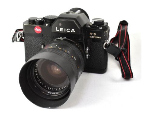 A Leica R3 electronic SLR film camera fitted with a Vario-Elmar-R 1:3.5-4.5/28-70 lens. CONDITION REPORT: The camera is in re