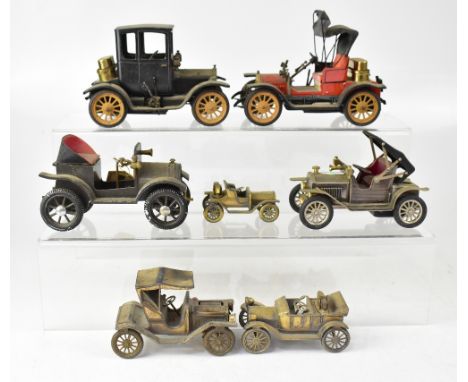 Seven vintage lighters in the form of town cars, one marked 'Japan', one marked 'Chevrolet 1913', another stamped 'Model T Fo