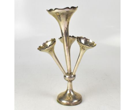 A George V hallmarked silver four-branch epergne, the fixed central trumpet-shaped vase with three smaller inserted trumpet-s