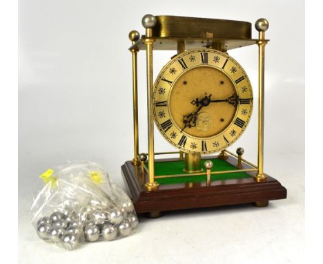 A Thwaites & Reed Ltd limited edition spheroid weight clock, one of 1000 world edition clocks, height approx 27cm. CONDITION 