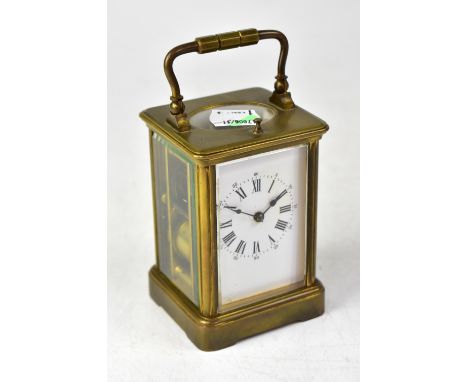 An early 20th century French brass carriage clock, the white dial set with Roman and Arabic numerals, height 11.5cm.  CONDITI