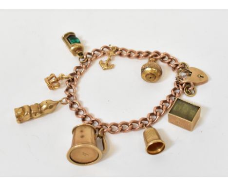 A 9ct rose gold belcher link charm bracelet with eight charms, to include vase, anchor, green lantern, crown, gnome, mug, thi