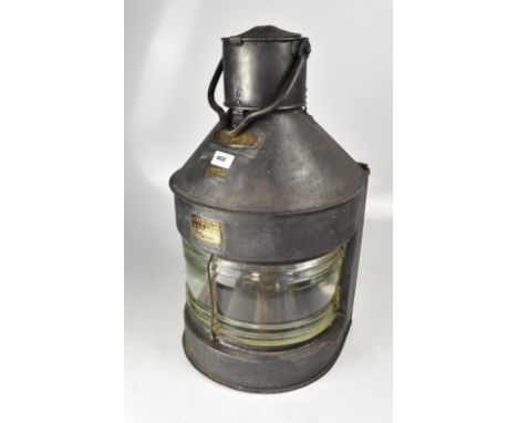 A large ship's lamp with several applied plaques, the main to the front of the lamp embossed 'Meteorite', A19639, further pla