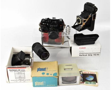 A collection of cameras and camera accessories including a Zenit 12XP, a King Penguin Kershaw eight-20 folding camera, a Plan