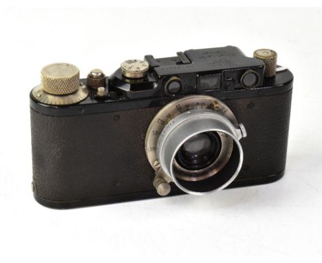 A Leica II film camera, serial no.192945, fitted with an Elmar F=5cm 1:3.5 lens, with additional lens hood.  CONDITION REPORT