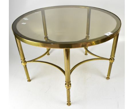A contemporary circular brass table with inset glass top on tapering fluted supports, diameter 60cm, and an early 20th centur